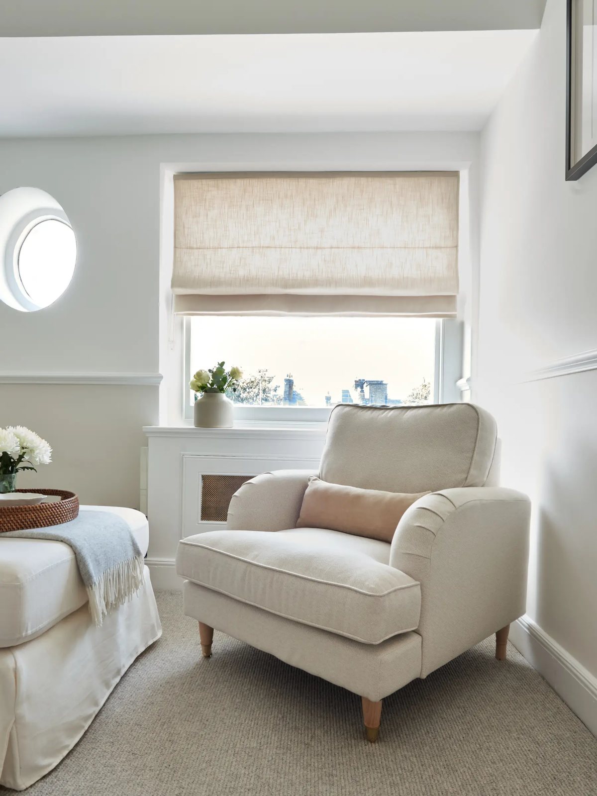 Room 3 — armchair beneath the porthole and sash windows