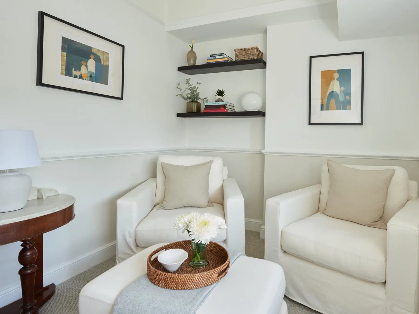 Room 3 — two armchairs beside the alcove shelving